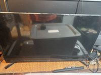 Front view of Samsung 32-inch TV on stand