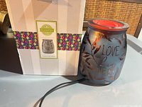 Warmer beside original box
