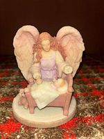 Front view of angel and baby figurine