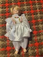 Full view of doll front, showing outfit and size reference