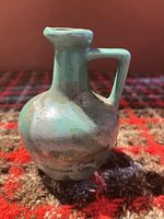 Front view showing pitcher form, glaze, handle and spout