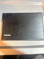 Closed Toshiba Satellite laptop top cover