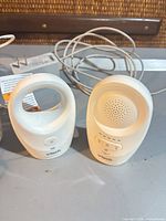 Parent and baby units with cords on table