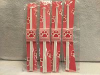Four packaged cat paw chopstick sets front view