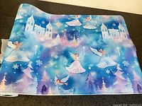 Full view of desk mat laid flat showing complete winter angel pattern