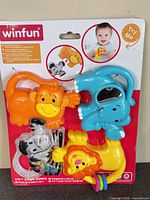 Front of sealed Winfun 4-in-1 Jungle Joiners packaging showing four animal rattles
