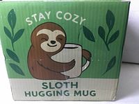 Front of retail box with Stay Cozy sloth graphic