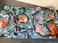 Top view of full desk mat showing cat illustration