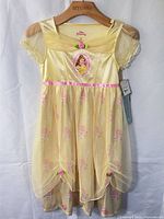 Front view of yellow Belle nightgown with overlay skirt and character graphic