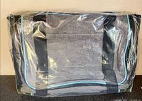 Carrier bag sealed in plastic, grey with aqua trim