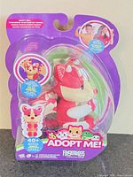 Front of sealed package showing Fingerlings Adopt Me fox toy