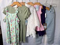 Six garments hung for overview