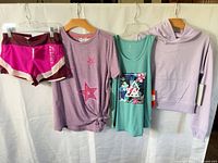 All four garments hanging for full view