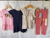 Full view of all four clothing items hanging