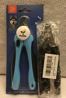 Front of blister-packed pet nail clipper next to bagged Toptato clipper
