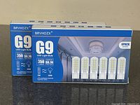 Front view of both BRVHOZX G9 LED bulb boxes