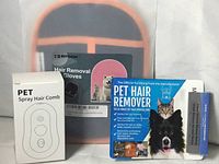 Front view of all three packaged pet hair removal products
