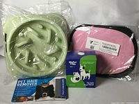 All four packaged pet items side by side