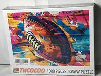 Front of sealed Tucocoo 1000-piece puzzle box
