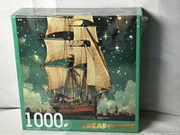 Front of sealed puzzle box with ship artwork and 1000 piece count