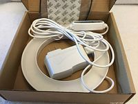 Ring LED grow light, AC adapter and inline controller inside box