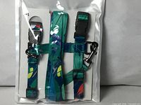 Front view of sealed package showing patterned harness and leash
