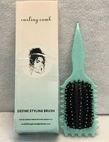 Front of box and brush showing bristle side