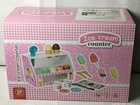 Front view of boxed ice cream counter toy set