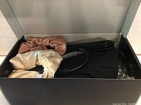 Box opened showing scrunchies and cord