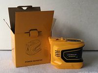Front view of inverter beside retail box