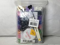 Front view of sealed bead kit showing contents in bag