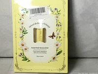 Front of sealed box showing product name and window with tube