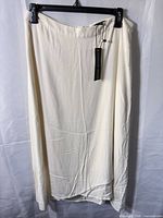 Front view of cream skirt showing length and color