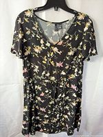 Front view of black floral Vero Moda dress on hanger