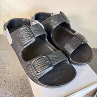 Top view of both sandals showing buckle straps and footbeds