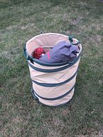 Pop-up hamper with tent bag and other gear inside