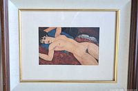 Close view of print within mat and frame showing subject and colors