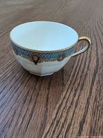 Side view of teacup showing pattern, handle and rim