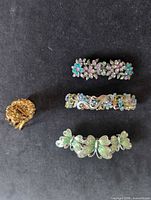 All four barrettes arranged on black background