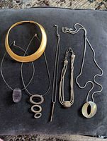 Group shot of six assorted necklaces laid out