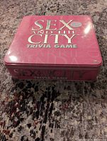Closed pink tin box top view