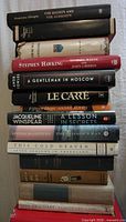 Vertical stack of books showing spines from top to bottom