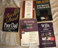 All five paperback books laid out showing front covers