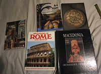 Front covers of all five books laid out