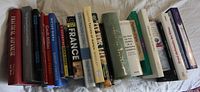 Full group of roughly 20 books laid flat spine up