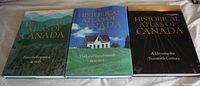 Front view of three hardcover volumes with dust jackets