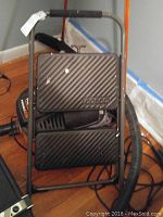 Black metal Coco branded step stool with two textured anti-slip steps and sturdy frame, photographed from the front side