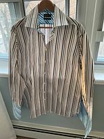 Front view of striped Ted Baker shirt on hanger