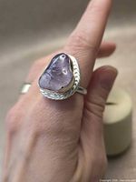 Ring on finger showing size and stone shape