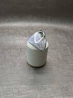 Front view showing triangular mother of pearl face in bezel